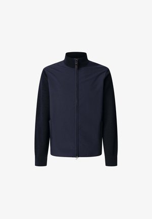 Laulupusu navy värvi tõmbluku jakki, mis on varustatud kõrge kaelusega ja tekstuuriga kudumihõlmadega; sile ja sujuv keha kangas; vormikas disain koos tõmblukuga.