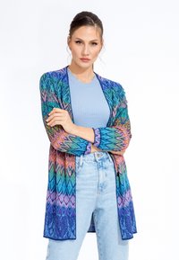 Knit cardigan with multicolored chevron pattern in blue, pink, and green. Open front, long sleeves, and a lightweight texture.