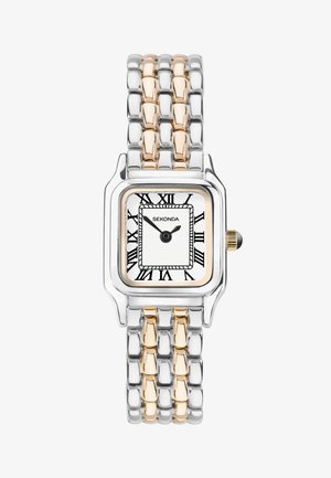 Montre en métal argenté et doré avec un cadran rectangulaire, un fond blanc, des chiffres romains et un motif texturé. Présente une couronne sur le côté.