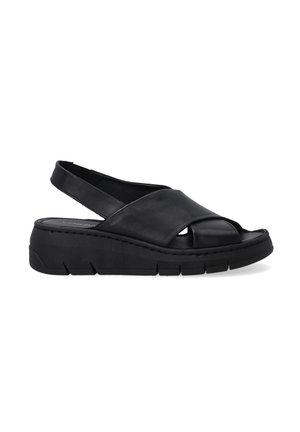 Black leather slingback sandals with a chunky black sole, open toe, and crisscross upper design. Features a smooth texture and minimal stitching.