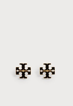 Paire de boucles d'oreilles clous en métal noir et or avec un motif symétrique en forme de croix sur fond blanc uni.