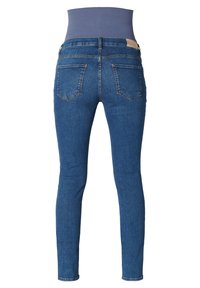 Vaqueros ajustados en denim azul oscuro con una cintura alta, que cuentan con dos bolsillos traseros y una textura suave. Costuras cosidas y áreas ligeramente desgastadas.