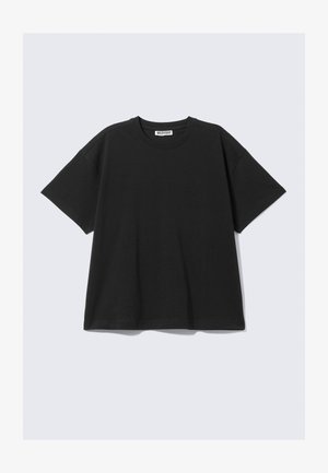 Svart kortärmad t-shirt i bomull med avslappnad passform, rundad halsringning och minimalistisk design. Inga mönster eller synliga detaljer.