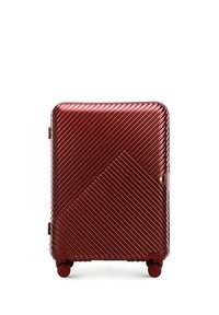Red hard-shell suitcase with diagonal ribbed texture, a geometric design, smooth surface, and four round wheels for mobility.