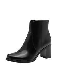 Stivali neri in pelle alla caviglia con punta appuntita, dettagli con ritagli laterali e tacco a blocco. Texture liscia con un design elegante e minimalista.