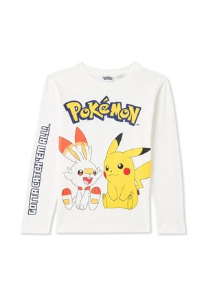 Maglietta bianca a maniche lunghe con una grafica di Pikachu e Scorbunny, con il testo "Pokémon" e "Gotta Catch 'Em All!" sulla manica.