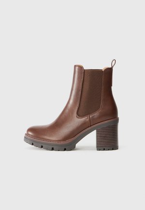 Brown leather ankle boot with elastic side panels, a rounded toe, and a textured block heel. Features a pull tab for easy wear.