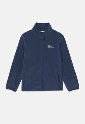 Veste en polaire navy avec col droit, fermeture éclair à l'avant, poches latérales et logo blanc sur la poitrine gauche. Texture douce.