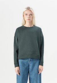 Dark green sweatshirt with a crew neck, dropped shoulders, and a cropped fit. Soft, smooth fabric with a minimalistic design.
