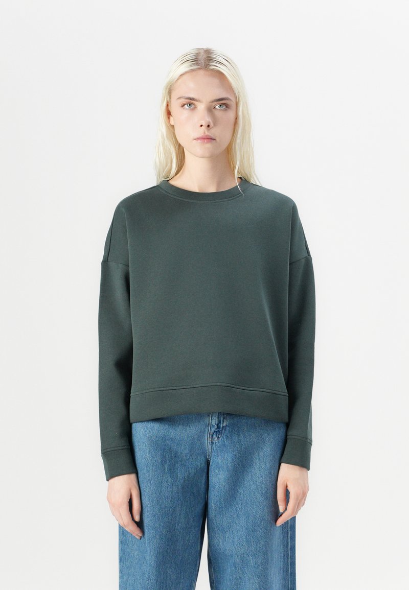 Dark green sweatshirt with a crew neck, dropped shoulders, and a cropped fit. Soft, smooth fabric with a minimalistic design.