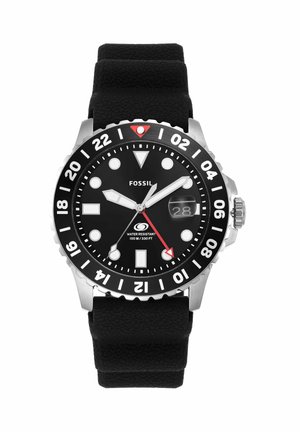 Zwart analoog duikhorloge van Fossil met zwarte siliconen band, witte uurmarkeringen, datumnummer en draaibare 24-uurs ring.
