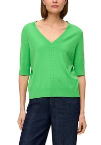 Grüner kurzärmliger V-Ausschnitt-Pullover aus Strickstoff, mit einem luftdurchlässigen Design und kleinen Durchbrüchen in der Mitte sowie einer lässigen Passform.