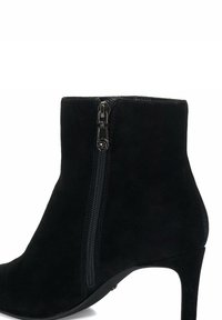 Black suede ankle boot with a sleek design, featuring a side zipper, pointed toe, and a slim high heel. Smooth texture and minimal accents.
