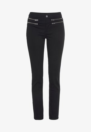 Pantalones negros ajustados hechos de material elástico, con dos bolsillos con cremallera en la parte delantera y una textura limpia y suave.