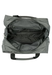 Sac en toile gris avec une fermeture éclair, intérieur spacieux, une poignée de transport, et une poche zippée supplémentaire à l'intérieur.