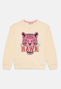 Krémová mikina s dlhým rukávom, na ktorej sa nachádza grafika ružovej leopardej hlavy s nápisom "RAWR" v červených písmenách.