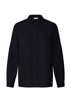 Chemise noire à manches longues avec boutons, col classique et tissu subtilement texturé, ornée d'un petit logo rond près de l'ourlet inférieur.