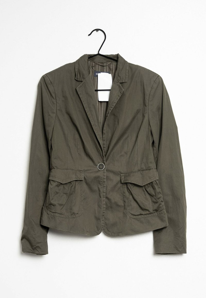 Olive green jacket with a notched collar, single button closure, two front pockets, and textured fabric, hanging from a black hook.