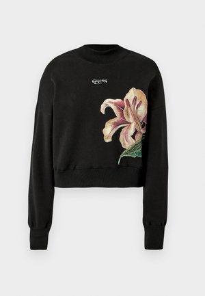 Sudadera negra corta con puños acanalados, que presenta un bordado floral multicolor en el lado izquierdo y un logotipo encima de la flor.