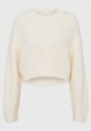 Skórzana bluzka w miękkim, puszystym kremowym materiale. Posiada okrągły dekolt i prążkowane mankiety. Prosty design bez wzorów czy akcentów.