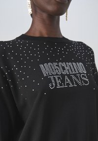 moschino dames trui