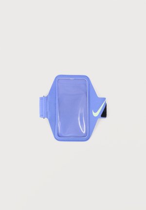 Blue sports armband with clear pouch and white Nike swoosh for holding a smartphone during exercise.