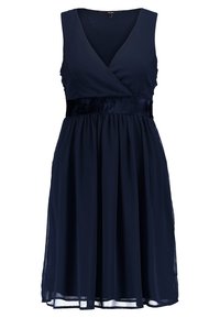 Robe sans manches bleu marine jusqu'aux genoux avec un col en V, une ceinture en velours ajustée et une jupe fluide en chiffon.
