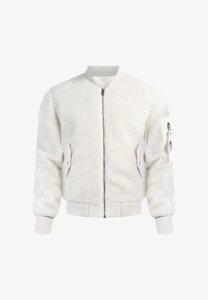 Hvid faux pelss bomberjakke med ribbede manchetter og kant, frontlynlås, sidelommer og en lynlåslomme på armen med et mærke.