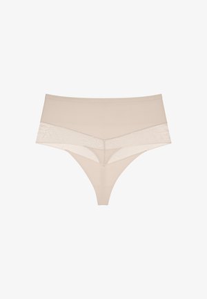 Culotte string taille haute beige avec des détails en dentelle sur les hanches et à l'avant sur un fond blanc.