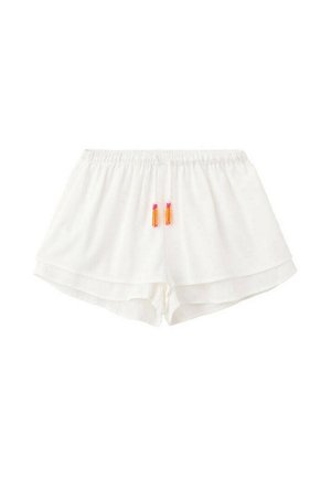 Short blanc à taille élastique avec ourlet superposé et pompons orange-rose sur le cordon devant au centre.