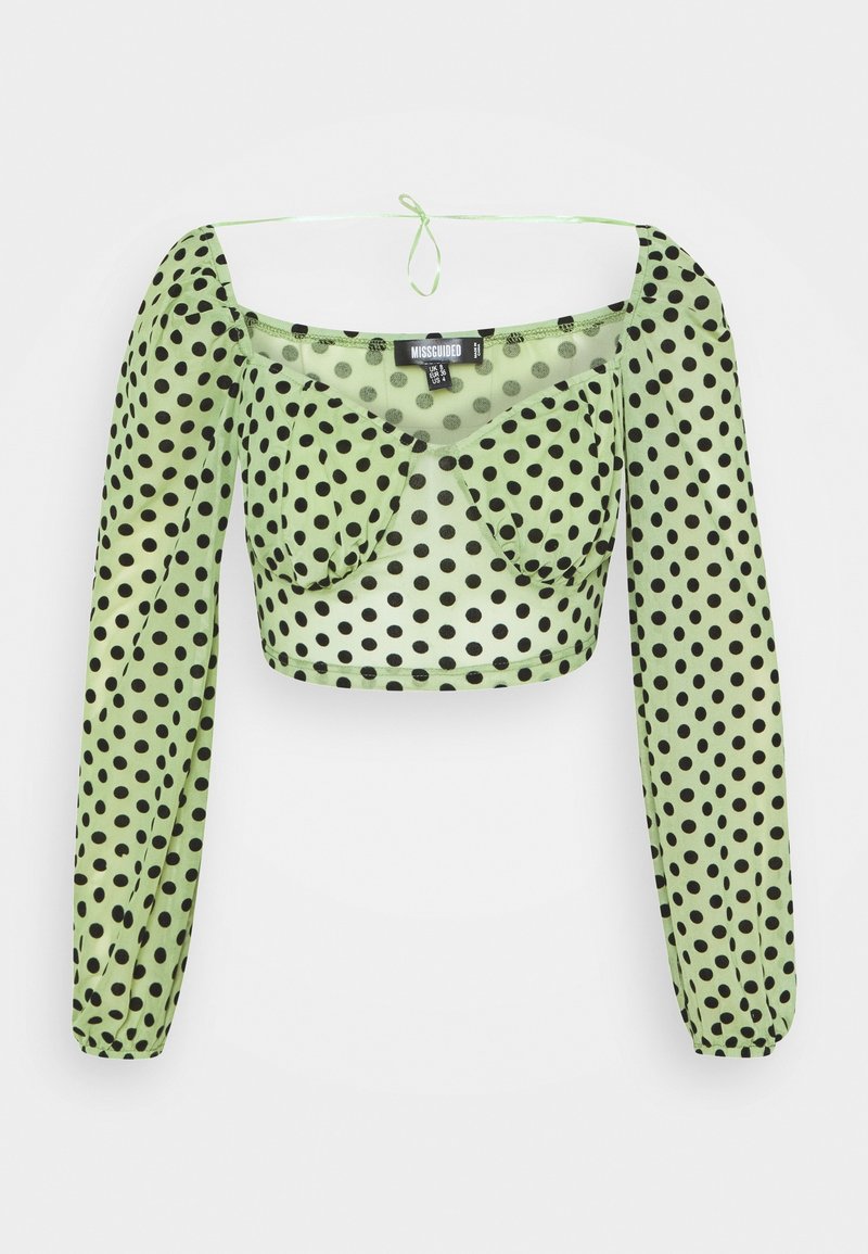 Grünes Pünktchen-Crop-Top mit langen Puffärmeln, mit einem quadratischen Ausschnitt und einer Schleifen-Detail hinten. Aus durchscheinendem Stoff hergestellt.