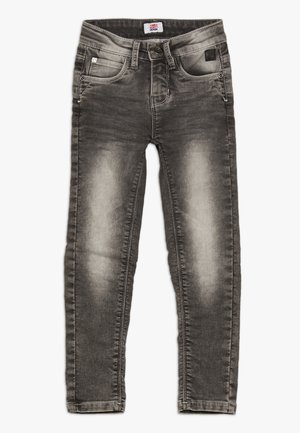 Jeans in denim grigio con design aderente, leggera scoloritura, cinque tasche e chiusura con bottone. Il materiale ha una texture liscia e morbida.