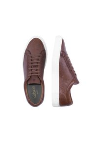 Brown leather sneakers with a textured finish, featuring a white rubber sole and intricate lace-up design, showing the brand name inside.