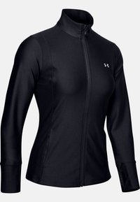 Svart zip-up jacka i ett slätt, stretchigt tyg med hög krage, långa ärmar och en liten logotyp på vänster bröst.