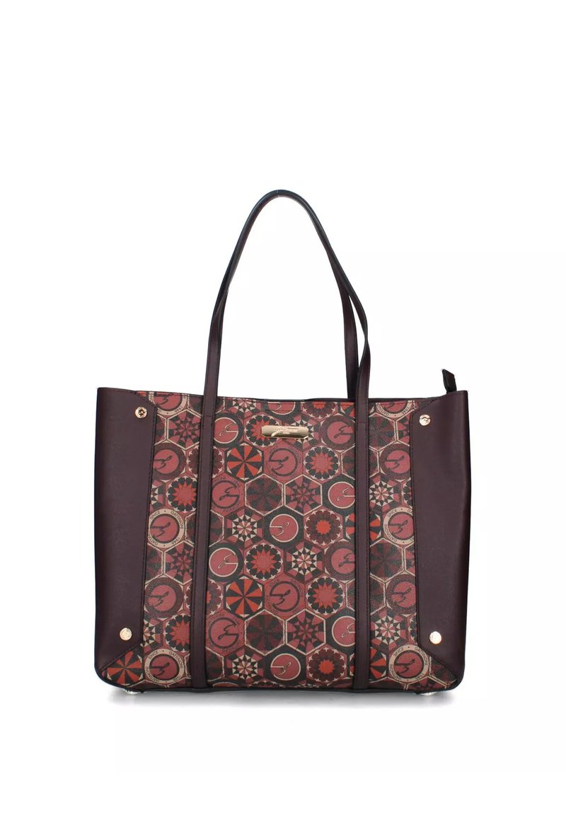 Bruine en kastanjebruine tote bag met gepatterniseerde hexagons en bloemmotieven, twee handvatten en goudkleurige studs op leren zijpanelen.