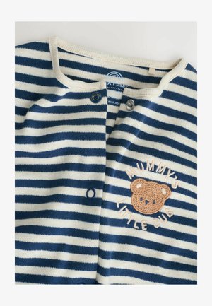 Striped long-sleeve top in navy and cream, featuring a bear embroidery and button closure at the neck. Soft fabric with ribbed detailing.