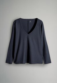 Mørkegrå langærmet V-hals top lavet af blødt, let materiale. Har en afslappet pasform og sideslids ved kanten for komfort.