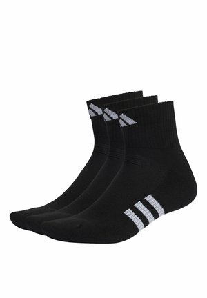 Calze nere alla caviglia con texture a coste, caratterizzate da tre strisce bianche al polsino e un design con logo. Confezione da tre paia.