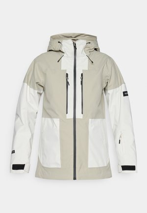 Veste extérieure légère en beige et blanc, avec une fermeture éclair à l'avant, deux poches sur la poitrine et une capuche ajustable avec cordons.