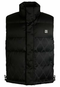 Black puffer vest with high collar, featuring a front zipper, large side pockets, and tonal logo detailing on quilted fabric.