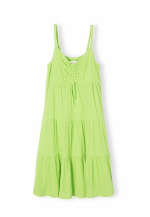 Jasnozielona sukienka na ramiączkach z regulowanymi cienkimi paskami, marszczeniem na biuście i wielowarstwowym falbankowym dołem dla dodania objętości.