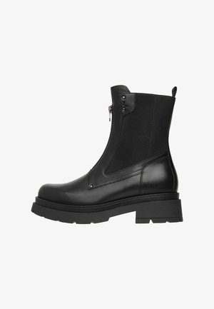 Black ankle boots with a smooth leather finish, elastic side panels, and a chunky rubber sole. Features an inner zipper and flat heel.