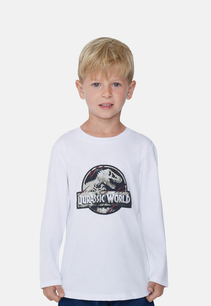 Biała T-shirt z długim rękawem, z graficznym nadrukiem dinozaura i napisem "Jurassic World" w czerni i czerwieni na przodzie.