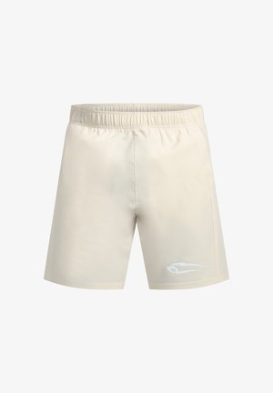 Shorts de sport couleur crème avec une taille élastique, texture lisse et un accent logo blanc sur le bas à gauche.