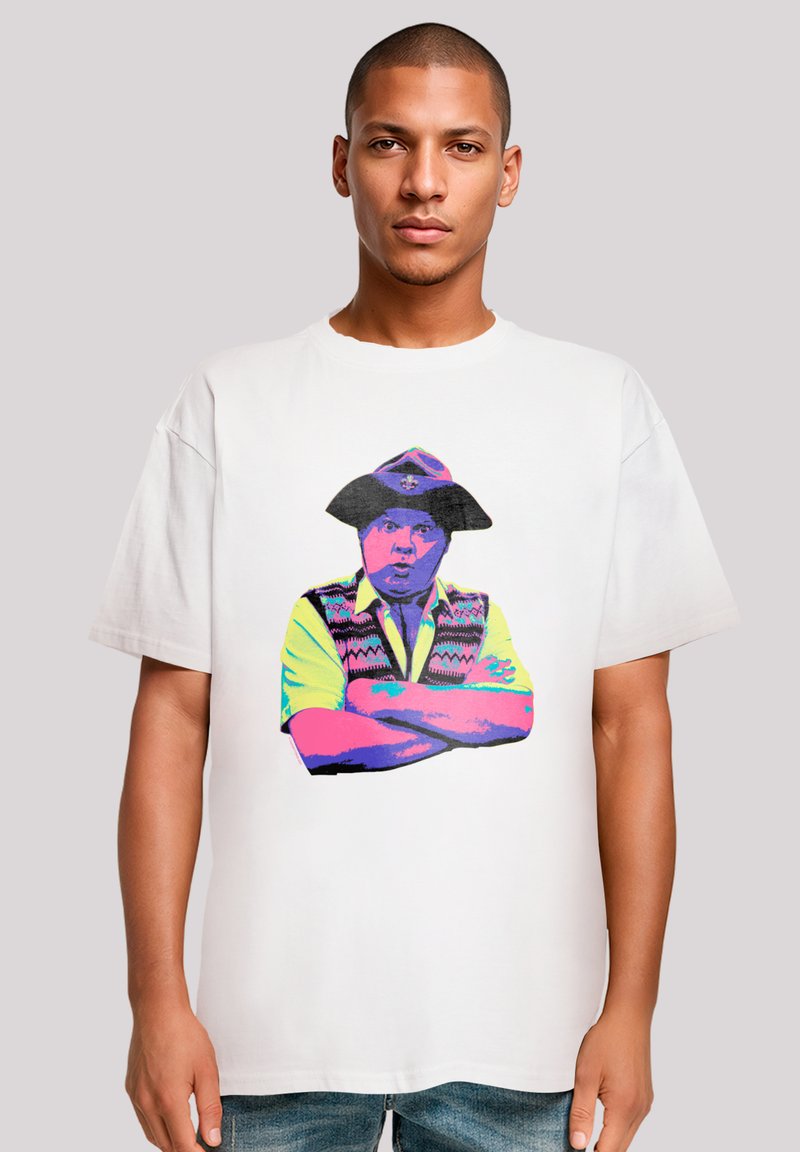 White cotton t-shirt featuring a colorful graphic of a man in a hat and vest, with crossed arms. The design is vibrant and bold.