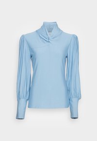 Light blue long-sleeve top with a high collar, gathered puff sleeves, and a twisted front detail; made from smooth, stretchy fabric.