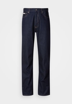 Dark blue denim jeans with a straight-leg design, featuring a button fly, five pockets, and contrasting stitching details.