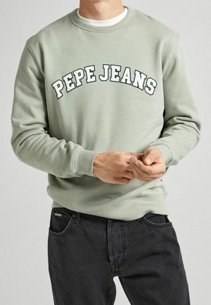 Felpa verde chiaro con scollo rotondo, con logo "PEPE JEANS" in verde scuro ad arco sulla parte anteriore. Tessuto morbido, polsini e orlo a coste.