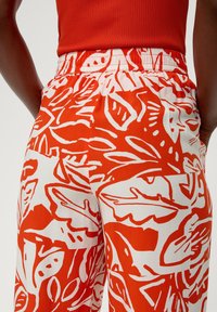 s.Oliver Tracksuit bottoms - dunkelorange