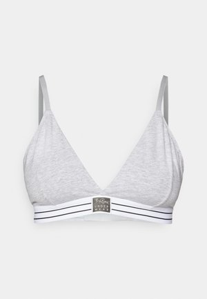 Bralette triangular gris hecho de un tejido suave con tirantes finos y una banda a rayas que presenta un parche con el logo en la parte delantera.